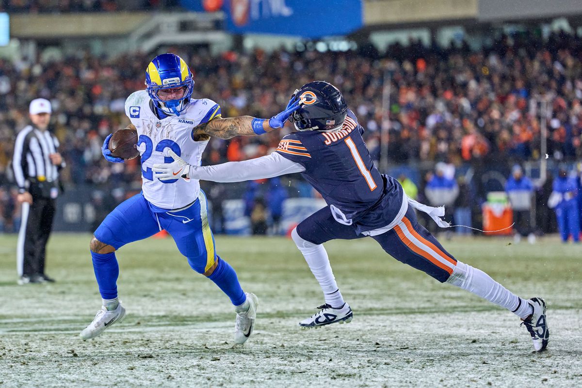 Los Angeles Rams running back Kyren Williams #23 battles with Chicago Bears cornerback Jaylon Johnson #1 to score a touchdown in the fourth quarter during an NFL Divisional football game against the Chicago Bears, on Sunday, January 18, 2026 in Chicago, Illinois.                              