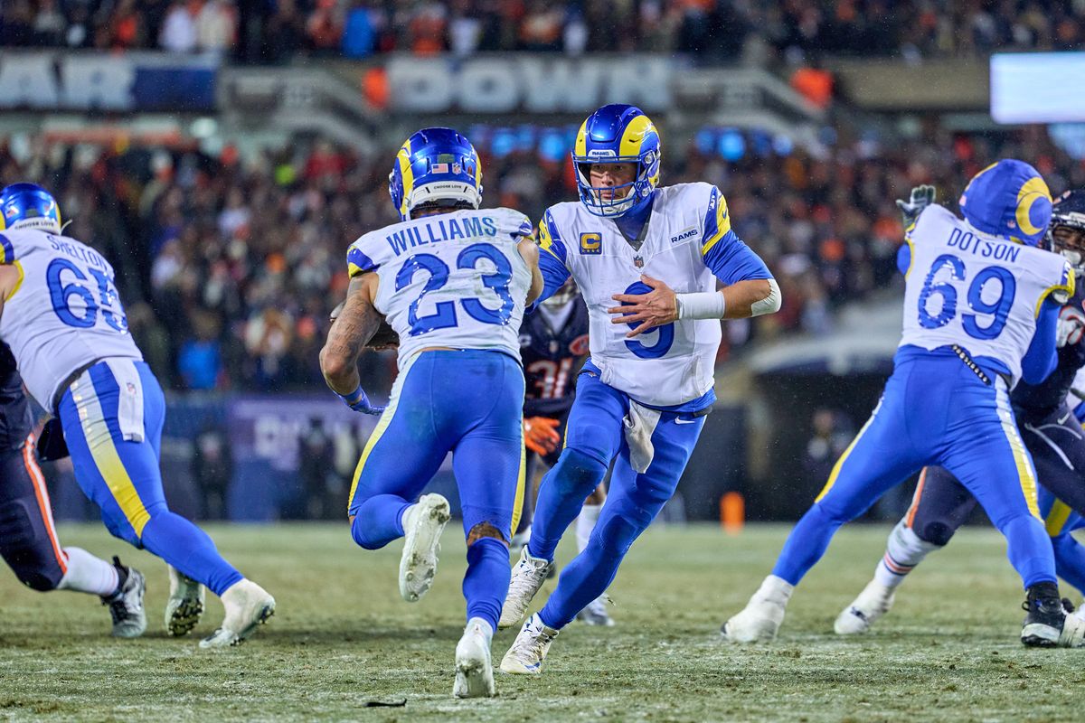 Los Angeles Rams quarterback Matthew Stafford #9 hands the football to Los Angeles Rams running back Kyren Williams #23 during a NFL Divisional football game against the Chicago Bears, on Sunday, January 18, 2026 in Chicago, Illinois.                              