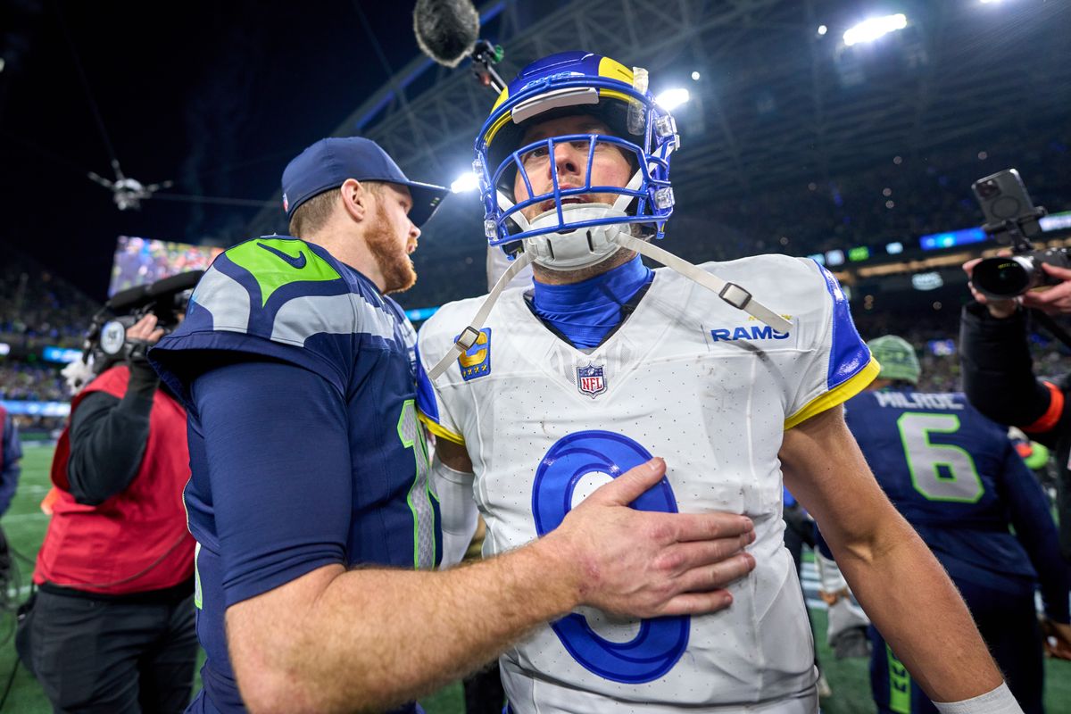 Los Angeles Rams quarterback Matthew Stafford #9 and Seattle Seahawks quarterback Sam Darnold #14 shake hands after the NFC Championship Game against the Seattle Seahawks, on Sunday January 25, 2026 in Seattle, Washington.  