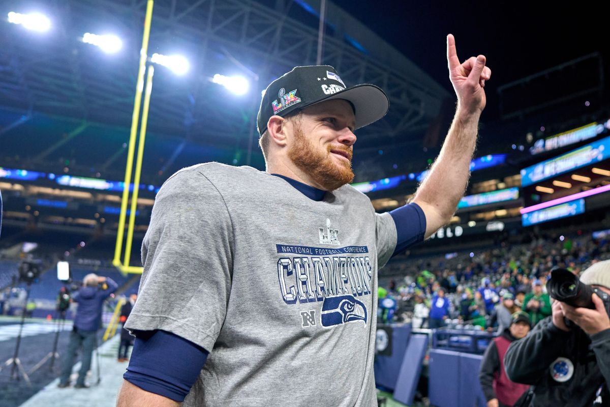 Seattle Seahawks quarterback Sam Darnold #14 celebrates with fans after the NFC Championship Game against the Los Angeles Rams, on Sunday January 25, 2026 in Seattle, Washington.  