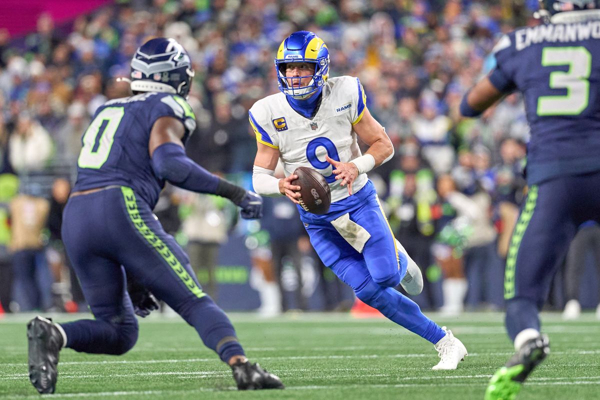 Los Angeles Rams quarterback Matthew Stafford #9 runs with the football during the NFC Championship Game against the Seattle Seahawks, on Sunday January 25, 2026 in Seattle, Washington.  