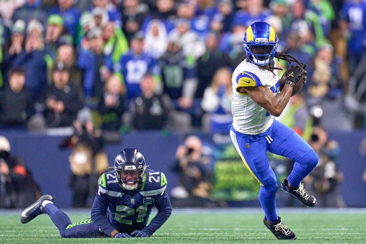 Los Angeles Rams wide receiver Davante Adams #17 runs with the football during the NFC Championship Game against the Seattle Seahawks, on Sunday January 25, 2026 in Seattle, Washington.  