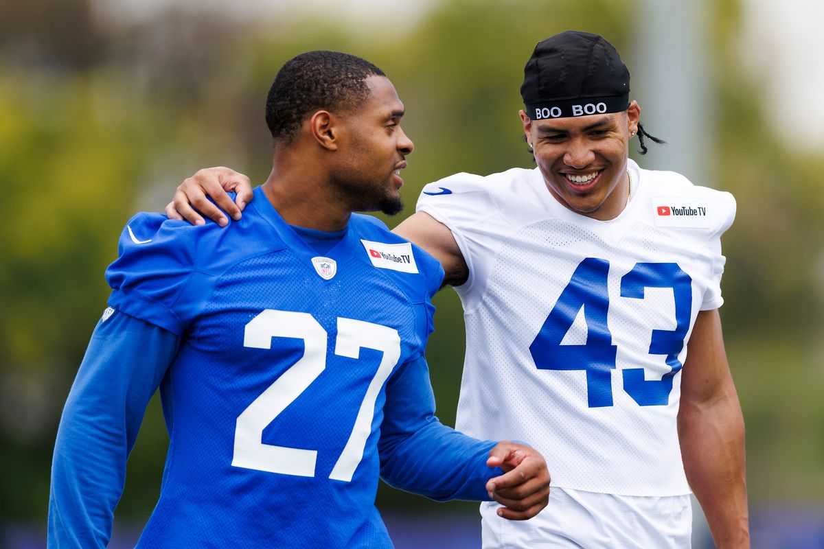 Jarquez Hunter #27 of the Los Angeles Rams and Nate Valcarcel #43 of the Los Angeles Rams laugh during an OTA offseason workout at Rams Village at Warner Center on May 26, 2026 in Woodland Hills, California. 