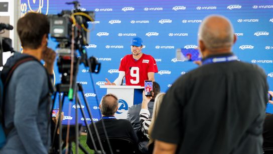 Matthew Stafford #9 of the Los Angeles Rams talks with members of the media after an OTA offseason workout at Rams Village at Warner Center on May 26, 2026 in Woodland Hills, California. 