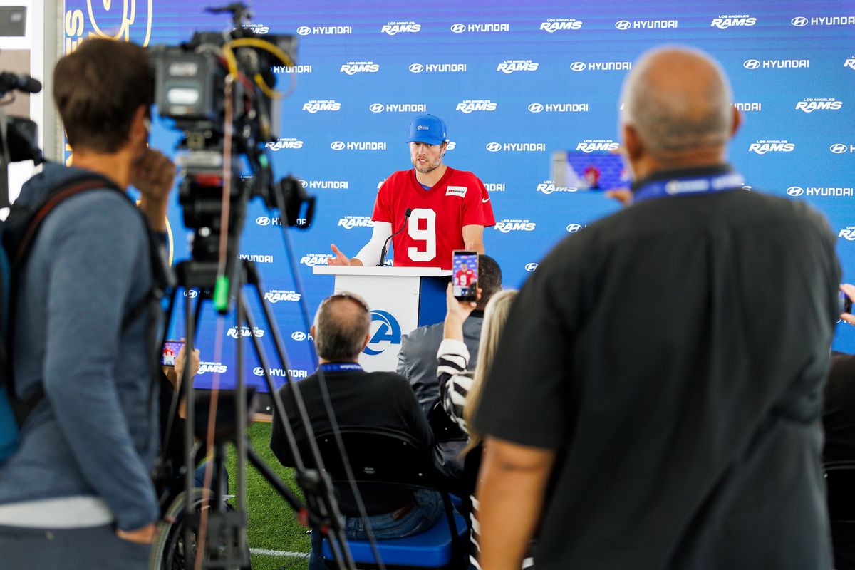 Matthew Stafford #9 of the Los Angeles Rams talks with members of the media after an OTA offseason workout at Rams Village at Warner Center on May 26, 2026 in Woodland Hills, California. 