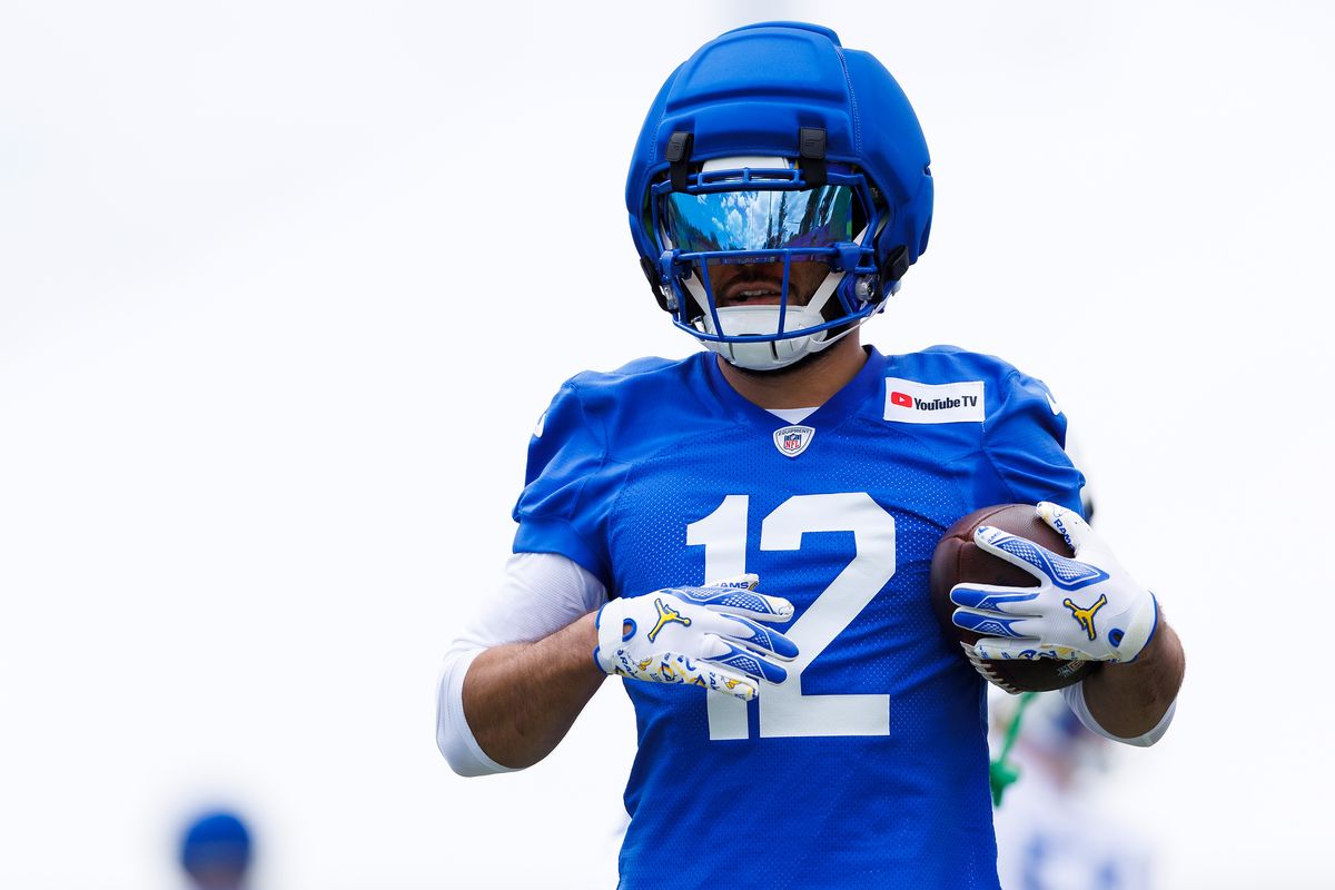 Puka Nacua #12 of the Los Angeles Rams runs after the catch during an OTA offseason workout at Rams Village at Warner Center on May 26, 2026 in Woodland Hills, California. 