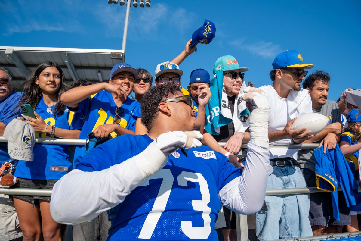 Los Angeles Rams offensive lineman Steve Avila (72) signing merchandise for fans during Rams training camp at the Loyola Marymount University on Monday, July 27th in Westchester, CA.