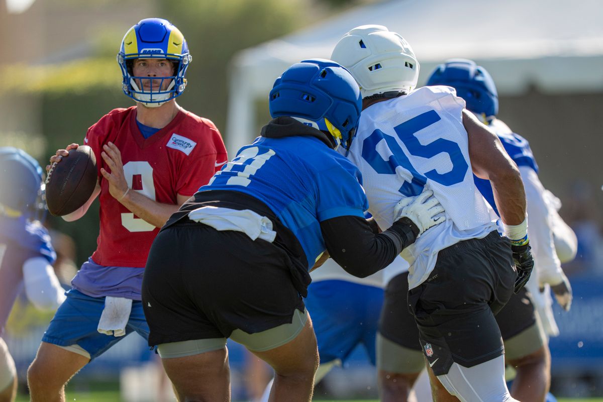 Los Angeles Rams quarterback Matthew Stafford (9) facing down Myles Garrett (95) during Rams training camp at the Loyola Marymount University on Monday, July 27th in Westchester, CA.