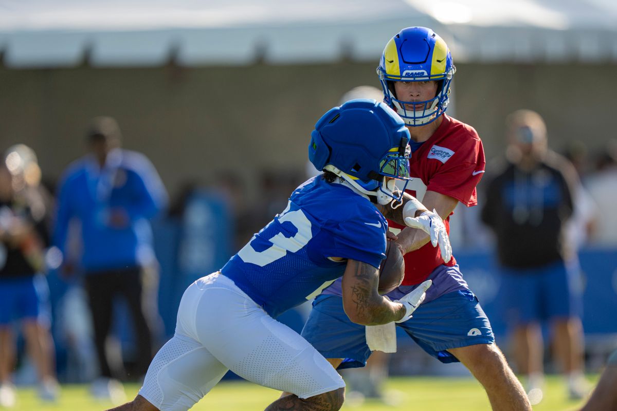 Los Angeles Rams quarterback Matthew Stafford (9) handing the ball off to Kyren Williams (23) during Rams training camp at the Loyola Marymount University on Monday, July 27th in Westchester, CA.