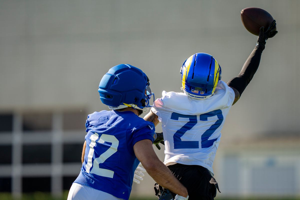 Los Angeles Rams cornerback Trent McDuffie (22) nearly intercepting a ball over the head of Puka Nacua (12) during Rams training camp at the Loyola Marymount University on Monday, July 27th in Westchester, CA.