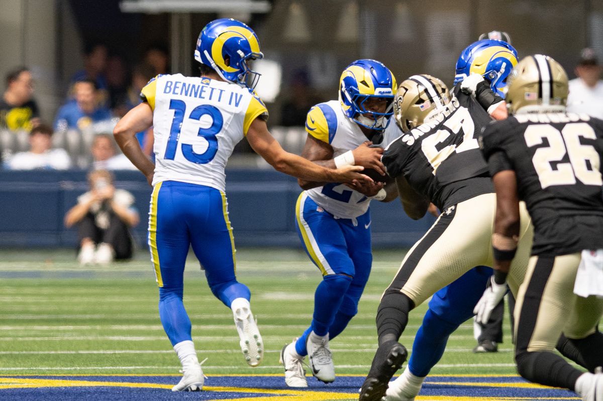 Los Angeles Rams quarterback Stetson Bennett IV (13) hands the ball off during an NFL preseason game between the New Orleans Saints and Los Angeles Rams on Saturday, August 22, 2026 at SoFi Stadium in Inglewood, California. Los Angeles Rams quarterback Stetson Bennett IV (13) hands the ball off during an NFL preseason game between the New Orleans Saints and Los Angeles Rams on Saturday, August 22, 2026 at SoFi Stadium in Inglewood, California.