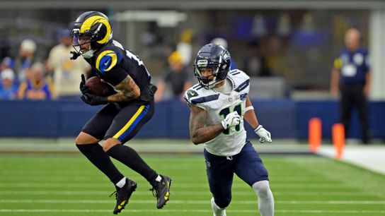 Los Angeles Rams cornerback Cobie Durant (14) makes an interception on a pass intended for Seattle Seahawks wide receiver Jaxon Smith-Njigba (11) during the second half at SoFi Stadium.