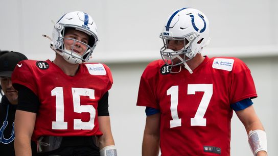 Indianapolis Colts quarterbacks Philip Rivers (17) and Riley Leonard (15) talk Wednesday, Dec. 10, 2025, during practice at the Colts training facility in Indianapolis.