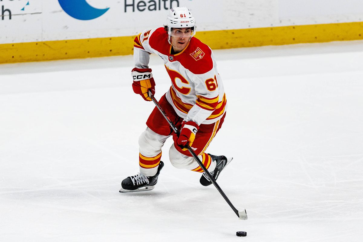 Aydar Suniev #61 of the Calgary Flames skates with the puck during an NHL game against the Anaheim Ducks on October 13, 2026 at Honda Center in Anaheim, California. Aydar Suniev #61 of the Calgary Flames skates with the puck during an NHL game against the Anaheim Ducks on October 13, 2026 at Honda Center in Anaheim, California.