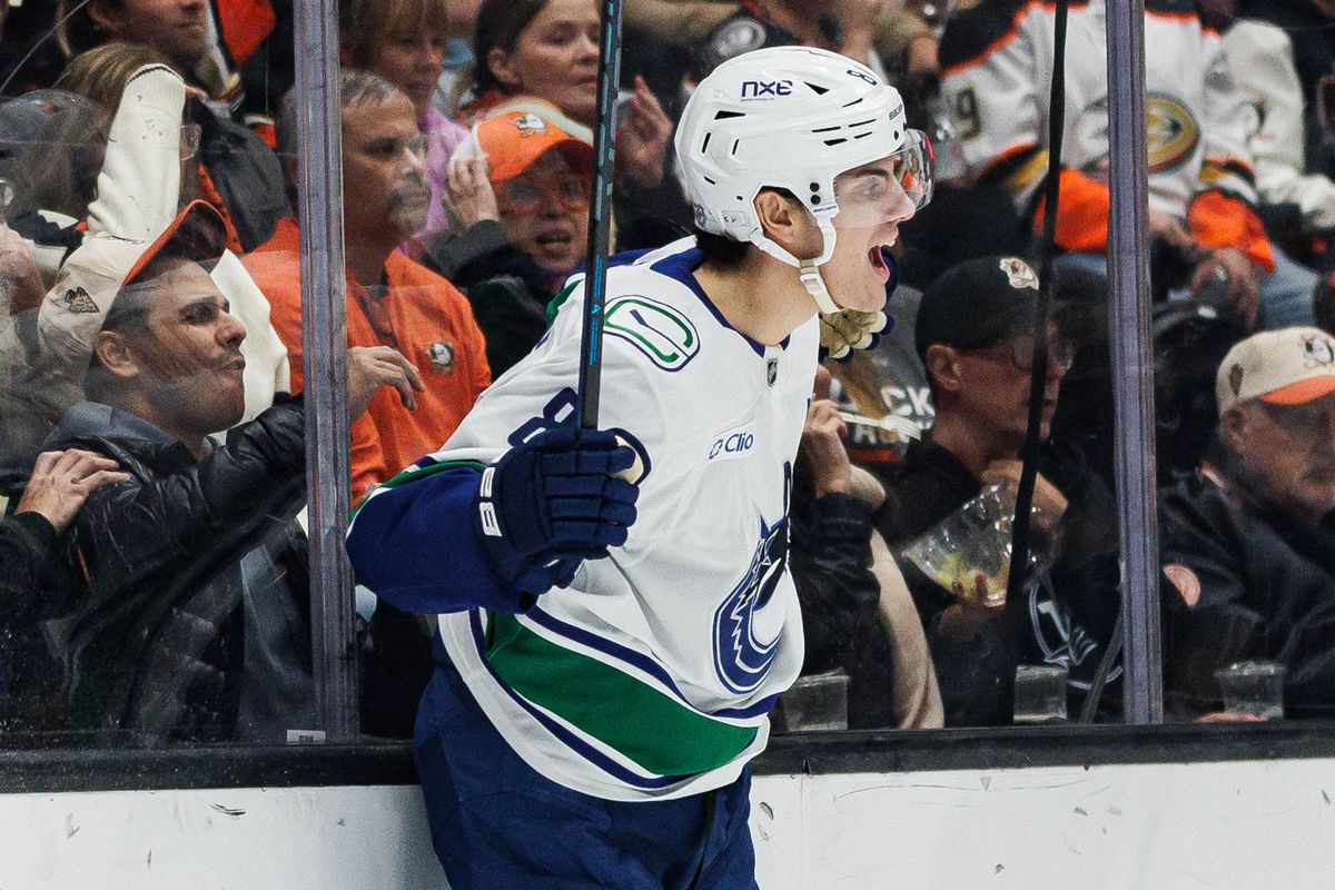 Zeev Buium #8 of the Vancouver Canucks celebrates after giving an assist during an NHL regular season game against the Anaheim Ducks on October 27, 2026 at Honda Center in Anaheim, California.
