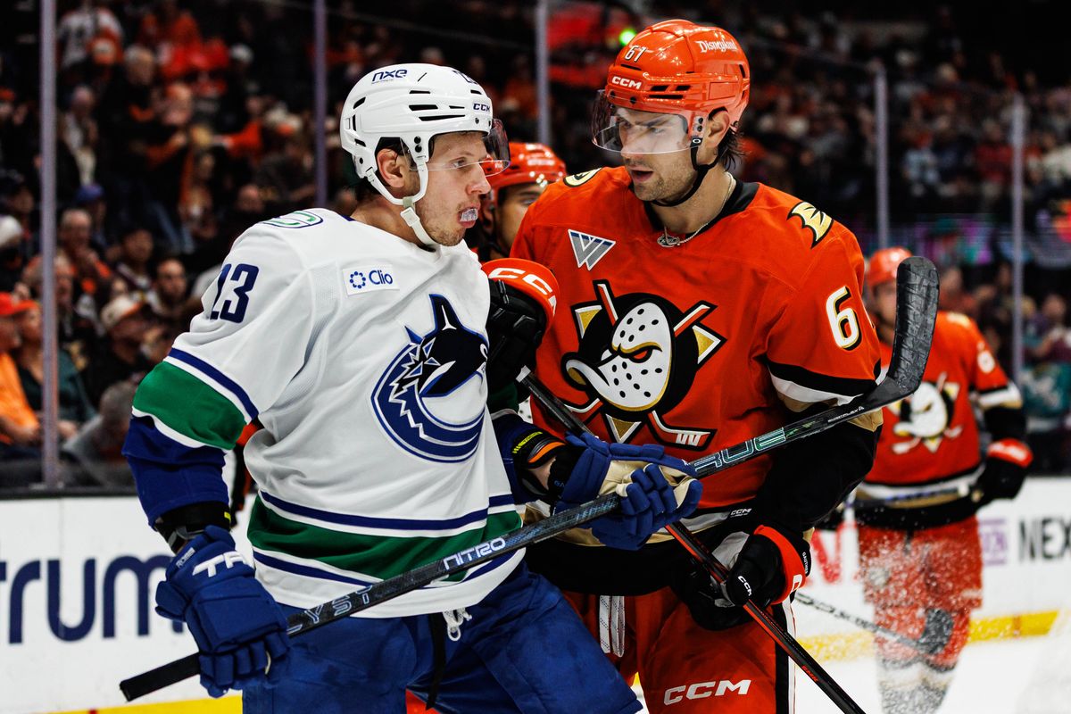 Cutter Gauthier #61 of the Anaheim Ducks interacts with Marco Rossi #23 of the Vancouver Canucks during an NHL regular season game against the Vancouver Canucks on October 27, 2026 at Honda Center in Anaheim, California.