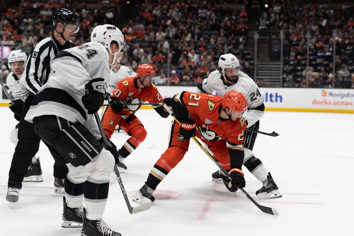 Anaheim Ducks C (21) Isac Lundestrom battling to get a pass against Kings C (24) Phillip Danault on November 29th, 2024 at the Honda Center in California. Anaheim Ducks C (21) Isac Lundestrom battling to get a pass against Kings C (24) Phillip Danault on November 29th, 2024 at the Honda Center in California.