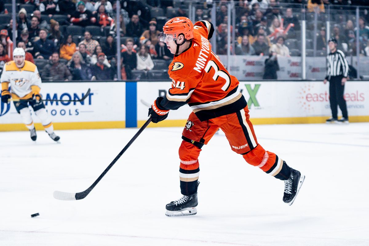 Anaheim Ducks D Pavel Mintyukov (34) passes the puck to a teammate in a game against the Nashville Predators on January 25, 2025 at the Honda Center in Anaheim, CA.