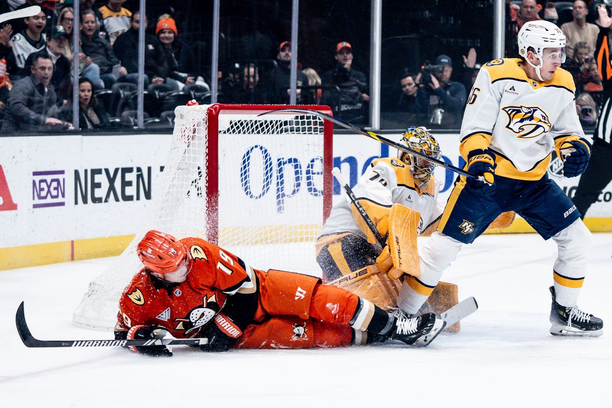 Anaheim Ducks RW Troy Terry (19) takes a shot to the goal while getting shoved over in a game against the Nashville Predators on January 25, 2025 at the Honda Center in Anaheim, CA.