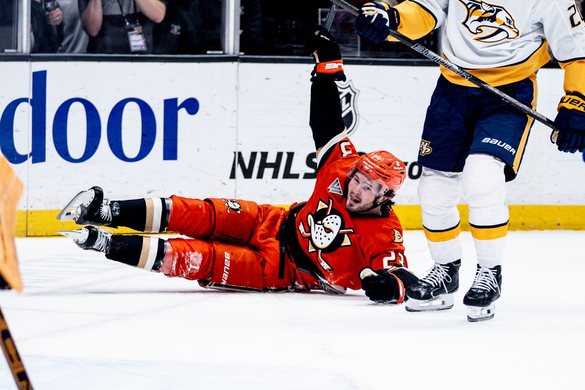 Anaheim Ducks C Mason Mctavish (23) celebrates scoring a goal while on the floor in a game against the Nashville Predators on January 25, 2025 at the Honda Center in Anaheim, CA.
