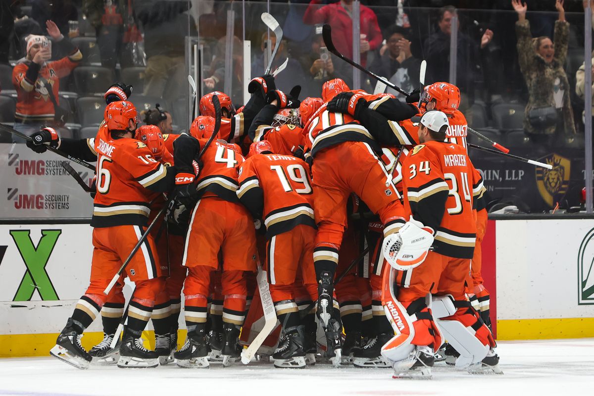 Anaheim Ducks players celebrate a game winning goal in overtime during an NHL game against the Utah Mammoth on November 17, 2025 in Anaheim, Calif.