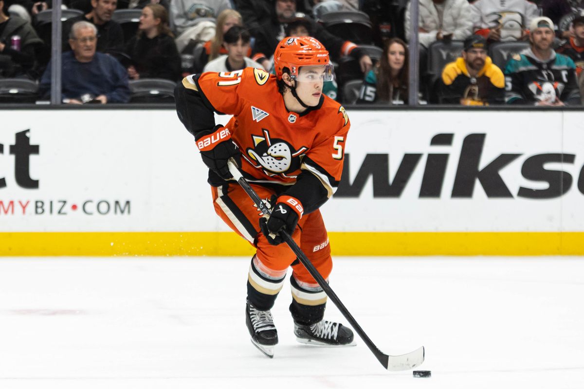 Anaheim Ducks D Olen Zellweger (51) looks to pass the puck during an NHL game against the Boston Bruins on November 19, 2025 in Anaheim, Calif.