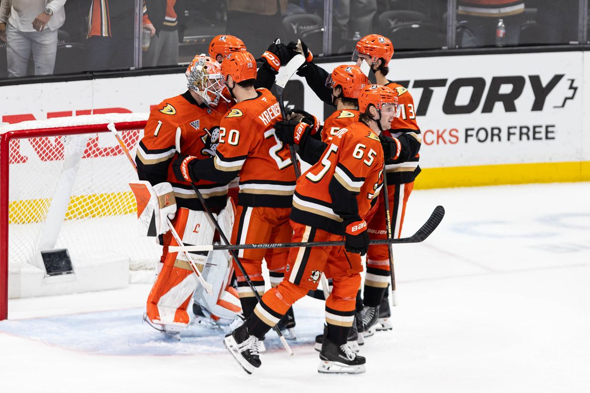 Anaheim Ducks players celebrate after winning the game during an NHL game against the Boston Bruins on November 19, 2025 in Anaheim, Calif.