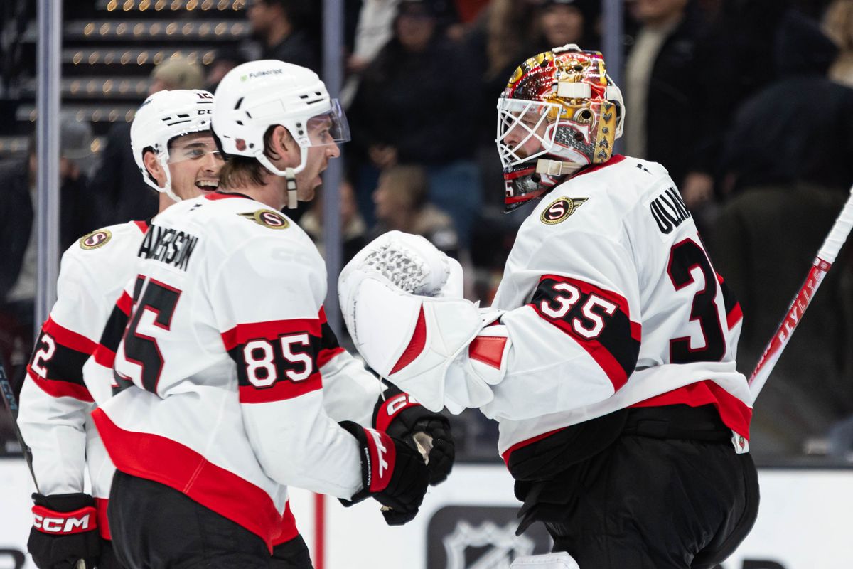 Ottawa Senators G Linus Ullmark (35) and D Jake Sanderson (85) celebrate after winning during an NHL game against the Anaheim Ducks on November 20, 2025 in Anaheim, Calif.
