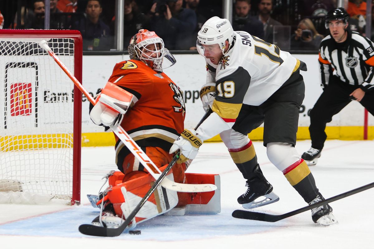 #1 G Lukas Dostal of the Anaheim Ducks attempts to make a stop on #19 RW Reilly Smith of the Vegas Golden Knights during an NHL game on November 22, 2025 in Anaheim, Calif.