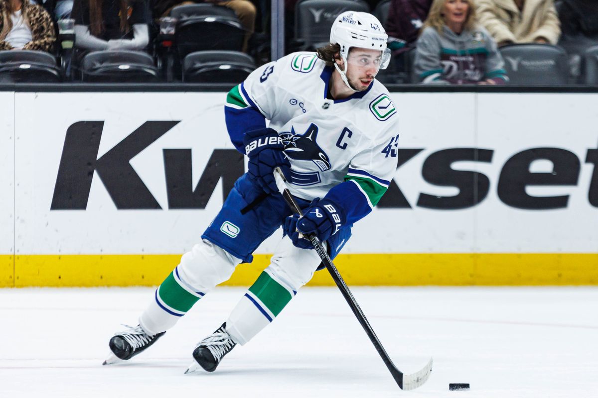 Vancouver Canucks defense Quinn Hughes (43) skates up with the puck during an NHL game against the Anaheim Ducks on November 26, 2025 in Anaheim, Calif.