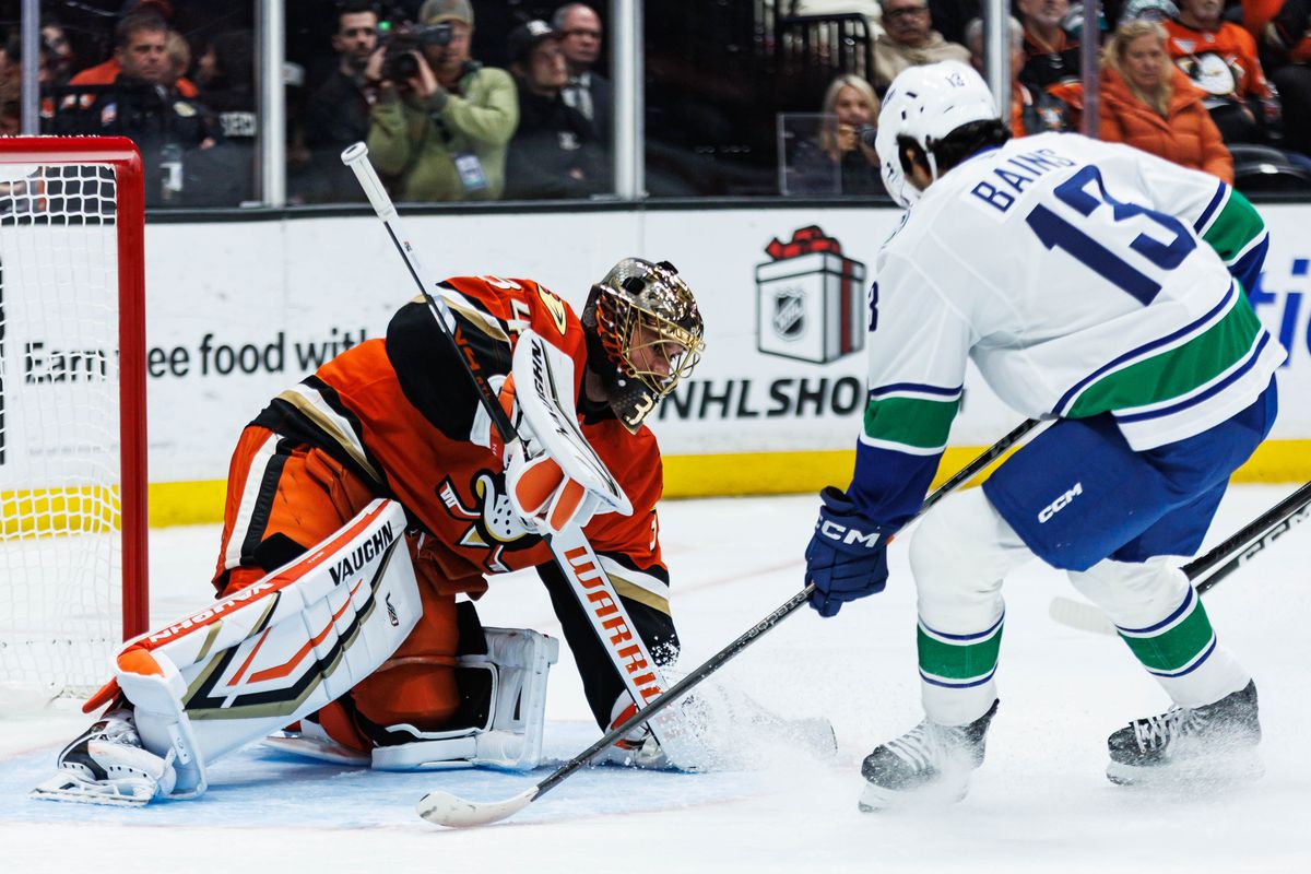 Anaheim Ducks goalie Petr Mrazek (34) blocks the puck during an NHL game against the Vancouver Canucks on November 26, 2025 in Anaheim, Calif.