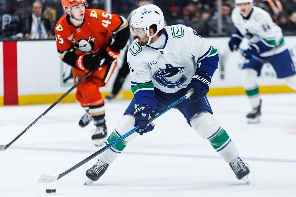 Vancouver Canucks right wing Conor Garland (8) looks to pass the puck during an NHL game against the Anaheim Ducks on November 26, 2025 in Anaheim, Calif.