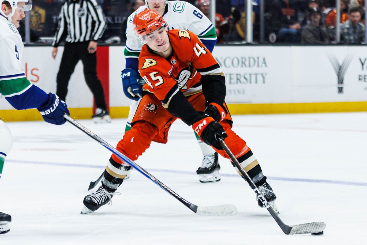 Anaheim Ducks right wing Beckett Sennecke (45) attempts to defend the puck during an NHL game against the Vancouver Canucks on November 26, 2025 in Anaheim, Calif.