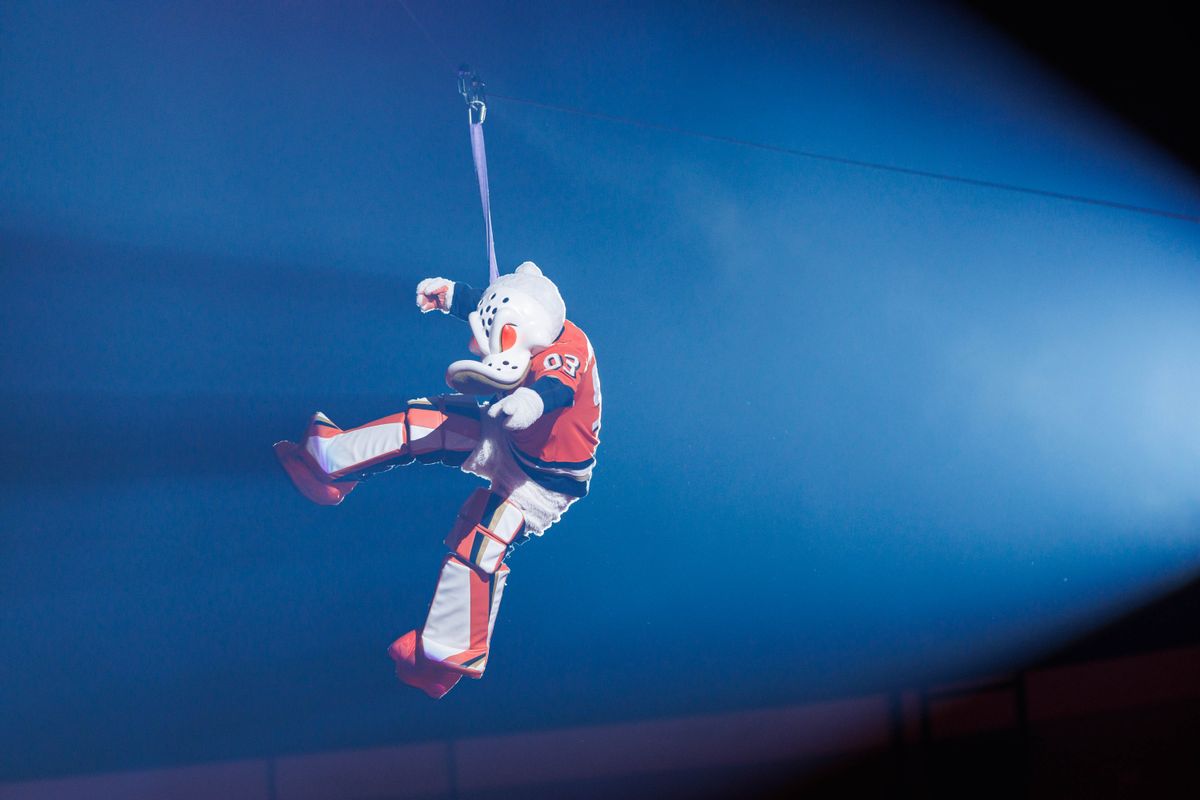 Anaheim Ducks' mascot Wild Wing rides a zipline in during pregame in an NHL game against the Los Angeles Kings on November 28, 2025 in Anaheim, Calif.