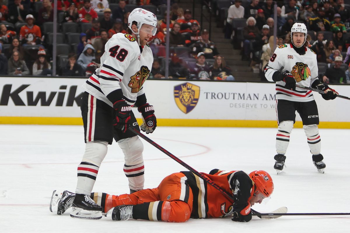 #48 D Matthew Grzelyck of the Chicago Blackhawks reacts to #77 LW Frank Vatrano of the Anaheim Ducks taking a hard fall on the ice during an NHL game against on December 7, 2025 in Anaheim, CA. #48 D Matthew Grzelyck of the Chicago Blackhawks reacts to #77 LW Frank Vatrano of the Anaheim Ducks taking a hard fall on the ice during an NHL game against on December 7, 2025 in Anaheim, CA.