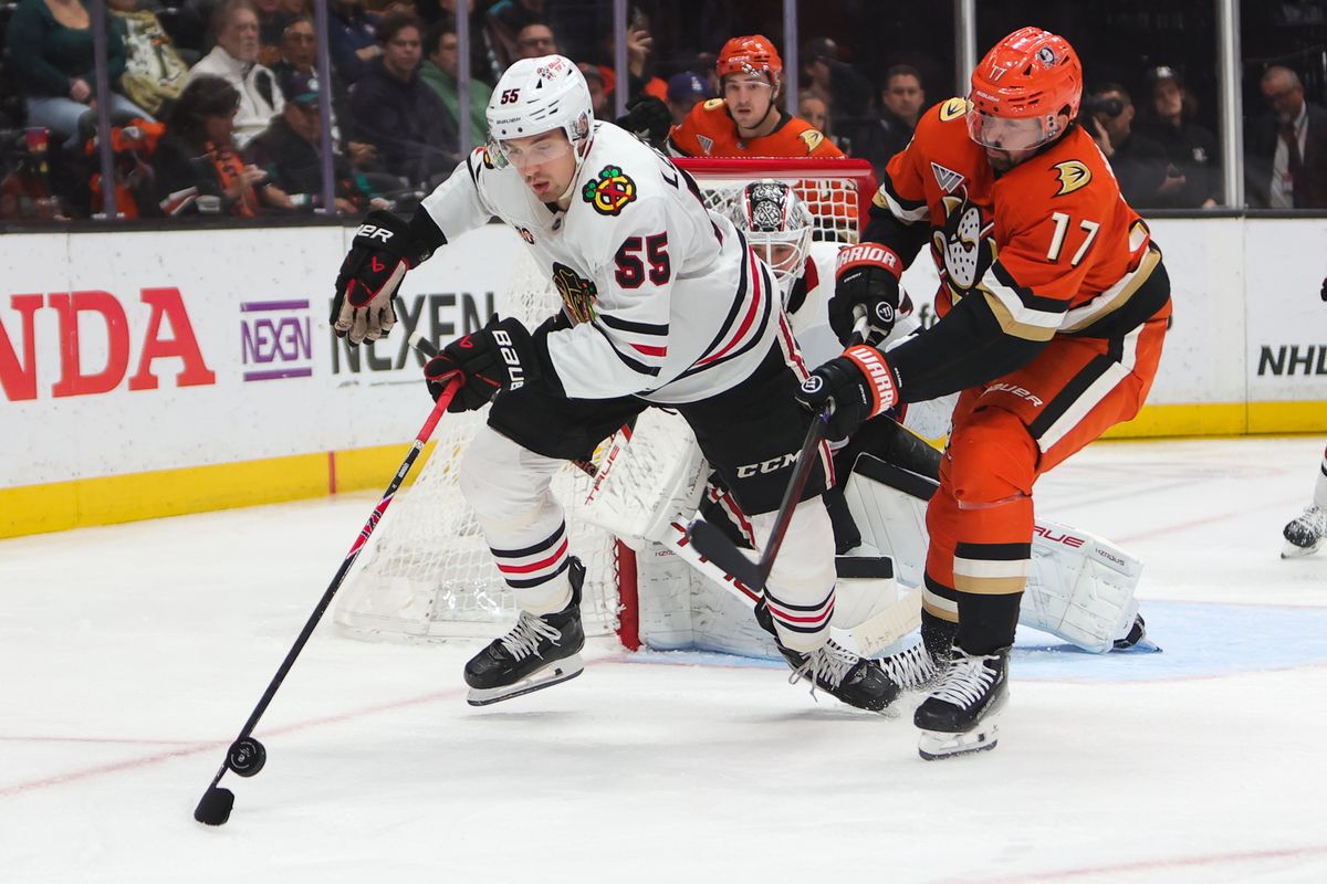 #55 D Artyom Levshunov of the Chicago Blackhawks and #17 LW Alex Killorn of the Anaheim Ducks battles for the puck during an NHL game on December 7, 2025 in Anaheim, CA. #55 D Artyom Levshunov of the Chicago Blackhawks and #17 LW Alex Killorn of the Anaheim Ducks battles for the puck during an NHL game on December 7, 2025 in Anaheim, CA.