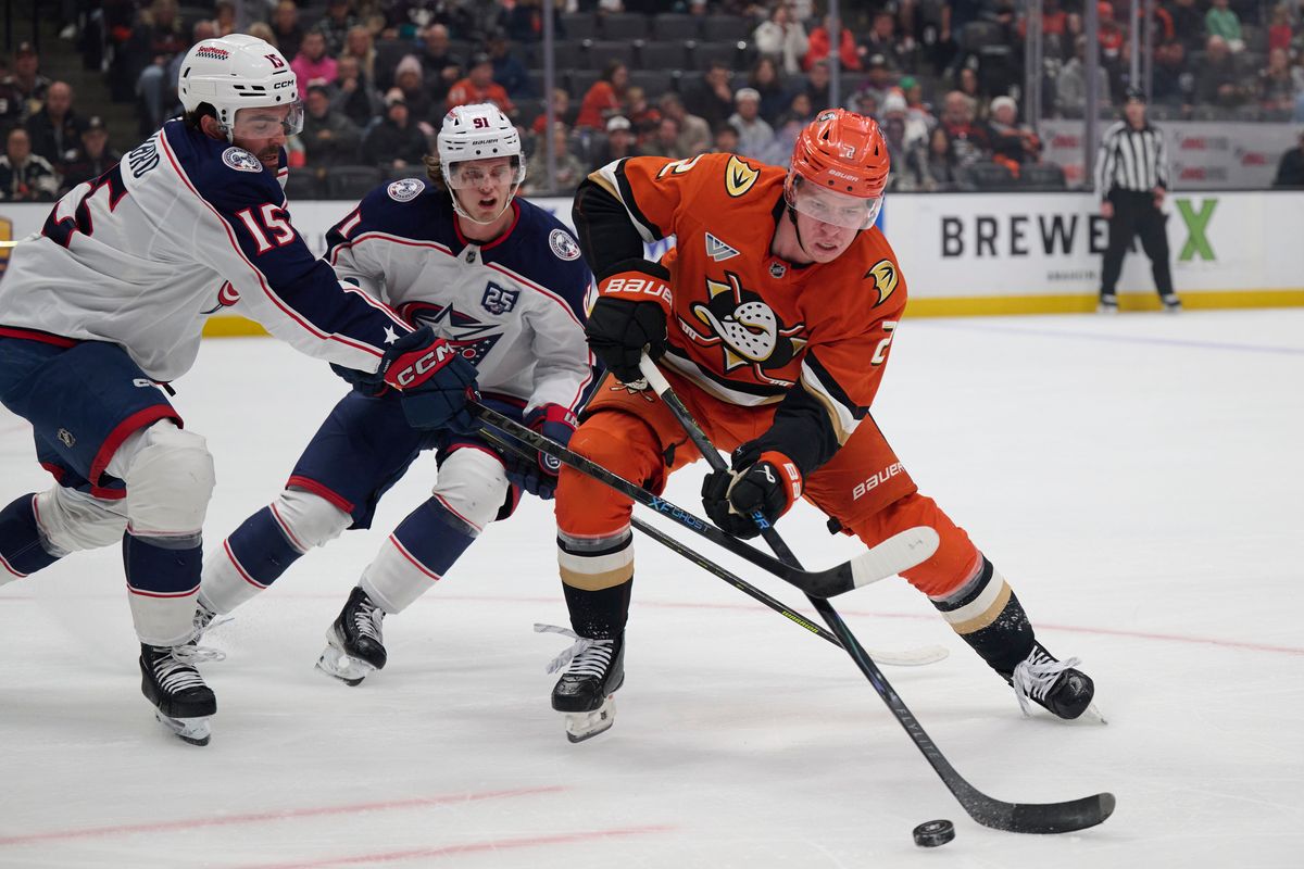 Jackson Lacombe #2 of the Anaheim Ducks fights for the puck against the Blue Jackets at the Honda Center on December 20,2025 in Anaheim, California.