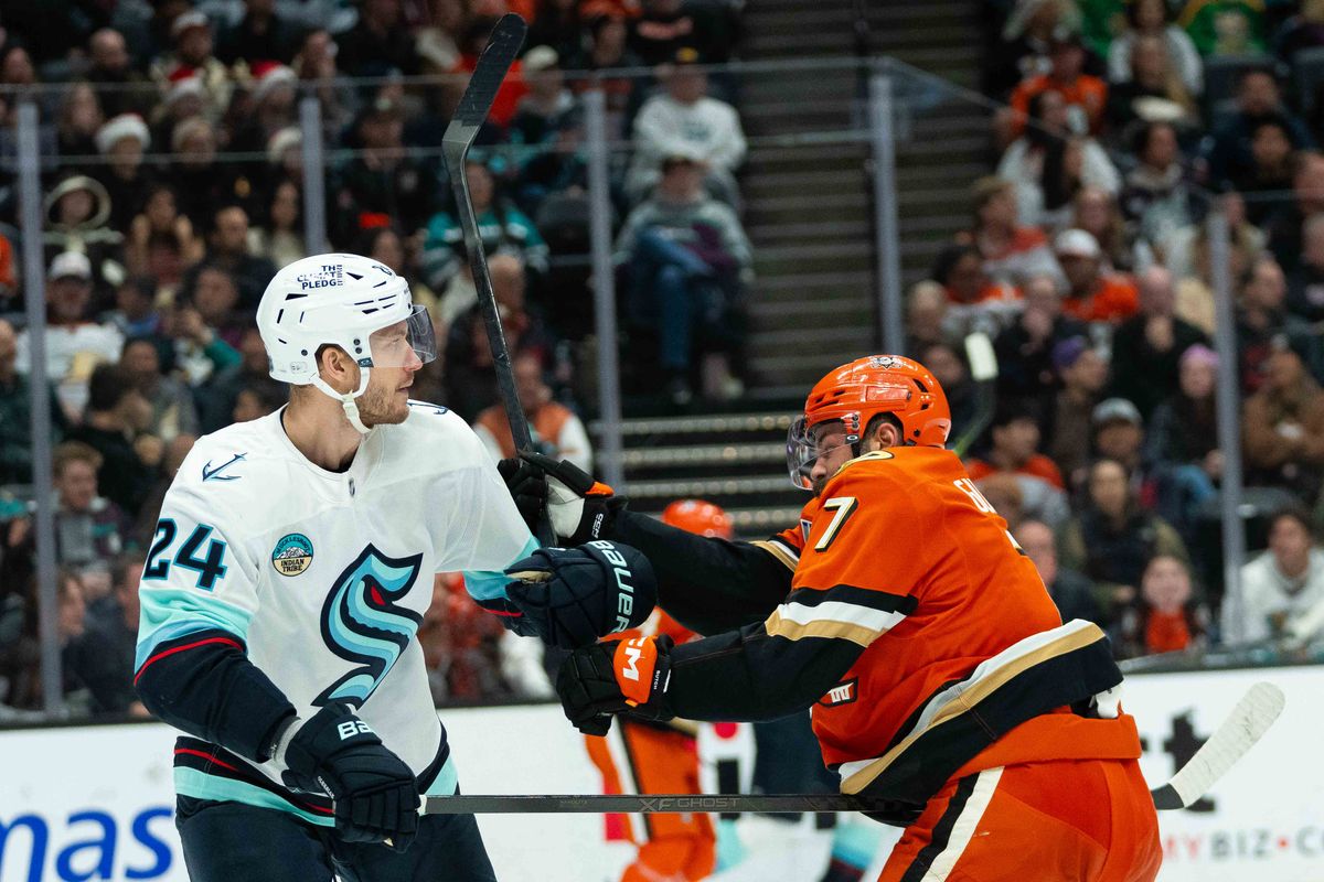 Anaheim Ducks defender Radko Gudas (7), gets tangled up with their opponent during an NHL hockey game against the Seattle Kraken, Monday, December 22nd, 2025 in Anaheim, California