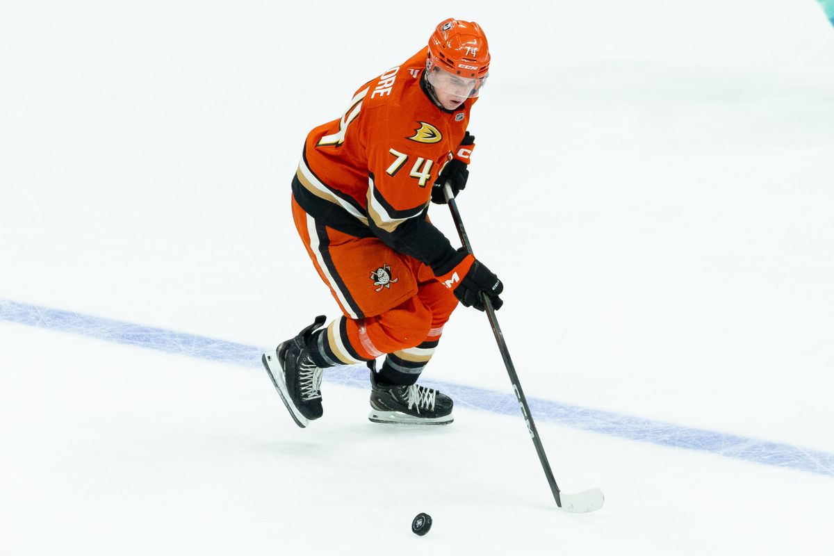 Anaheim Ducks defender Ian Moore (74), gaining possession of the puck during an NHL hockey game against the Seattle Kraken, Monday, December 22nd, 2025 in Anaheim, California
