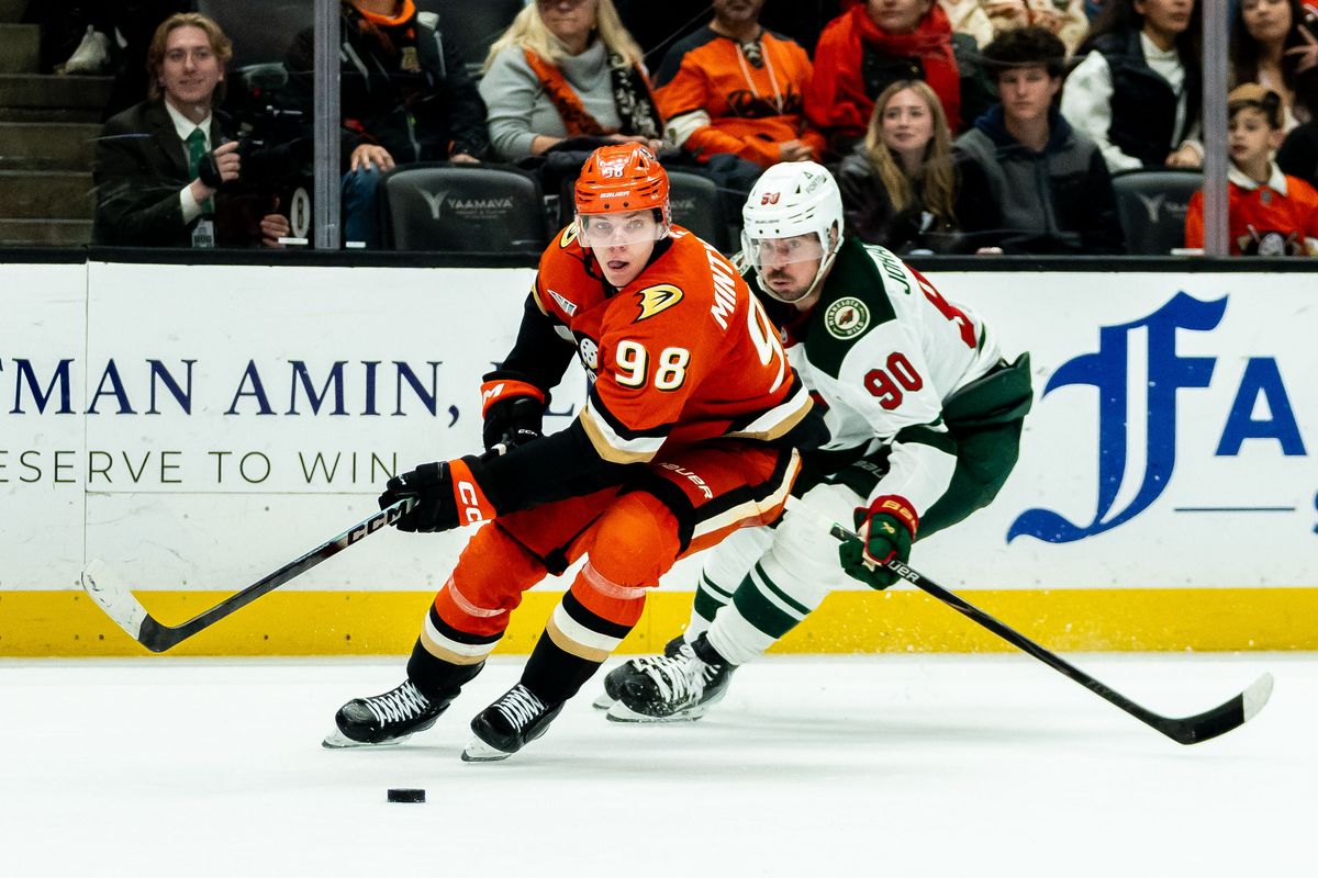 Anaheim Ducks defender Pavel Mintyukov (98) fights for possession during an NHL hockey game against the Minnesota Wild, Friday, January 2nd, 2026 in Anaheim, California