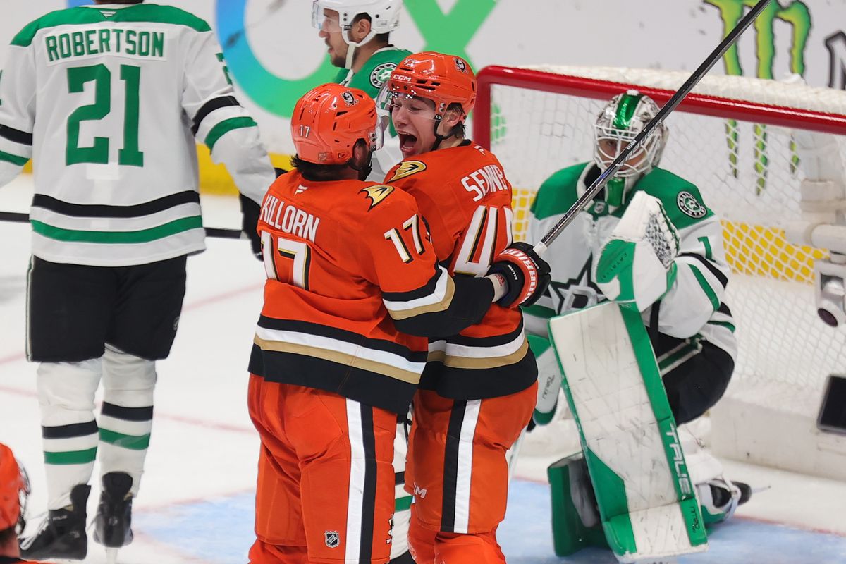 Anaheim Ducks right winger Beckett Sennecke (45) celebrates a goal with teammate left winger Alex Killorn (17) during an NHL game against the Dallas Stars on January 13, 2026 in Anaheim, CA.