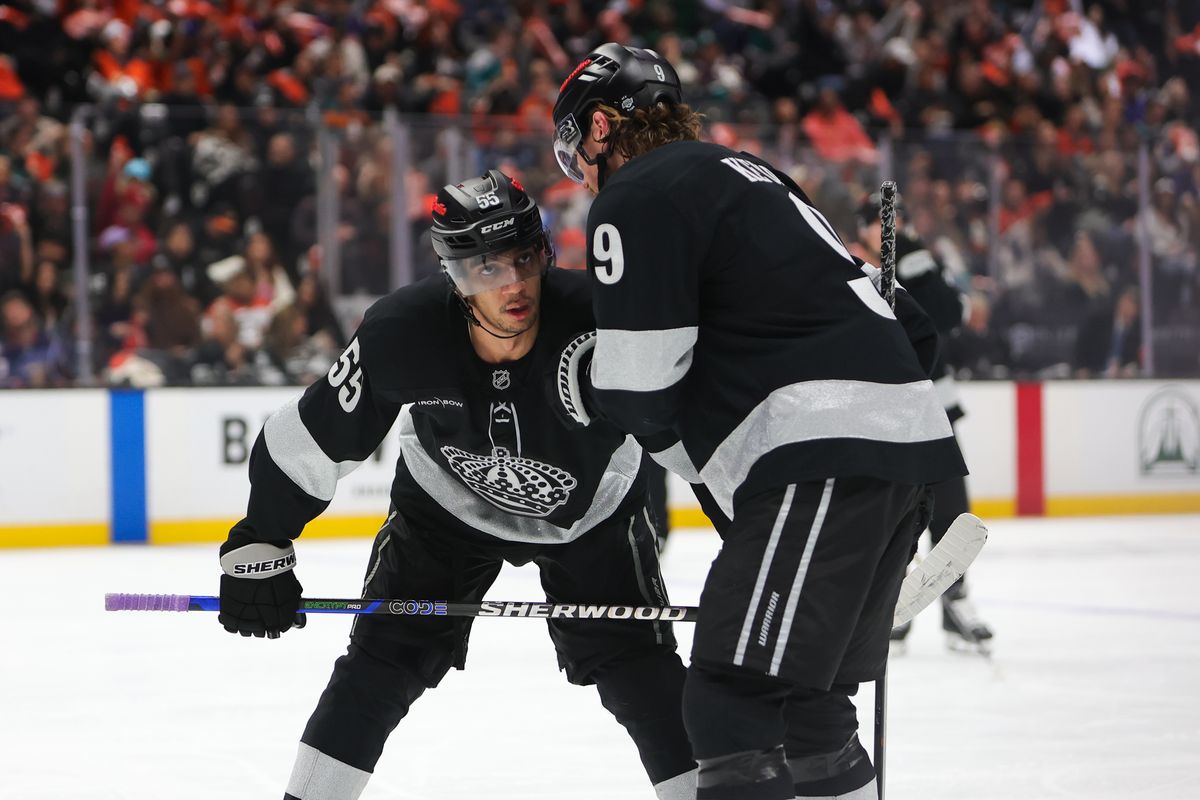 Los Angeles Kings right wing Adrian Kempe (9) discusses strategy with teammate right wing Quinton Byfield (55) during an NHL game against the Anaheim Ducks on January 17, 2026 in Anaheim, CA.