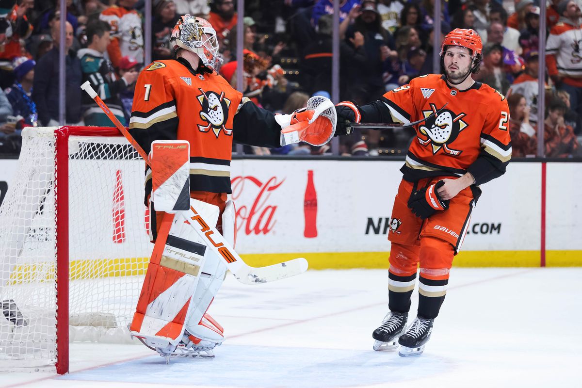 Anaheim Ducks center Mason McTavish (23) celebrates with goalie Lukas Dostal (1) after scoring during the NHL game against the New York Rangers, Monday January 19th, 2026 at Honda Center in Anaheim, Calif.