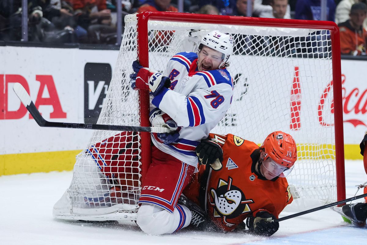Anaheim Ducks defenseman Drew Helleson (14) collides with New York Rangers left wing Brennan Othmann (78) during the NHL game, Monday January 19th, 2026 at Honda Center in Anaheim, Calif.
