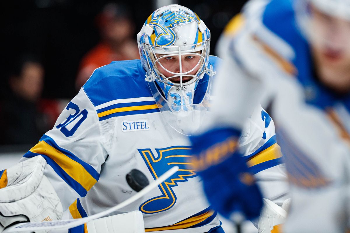 St. Louis Blues goaltender Joel Hofer (30) deflects a puck during warmups before an NHL match against the Anaheim Ducks on March 8, 2026 in Anaheim, California.