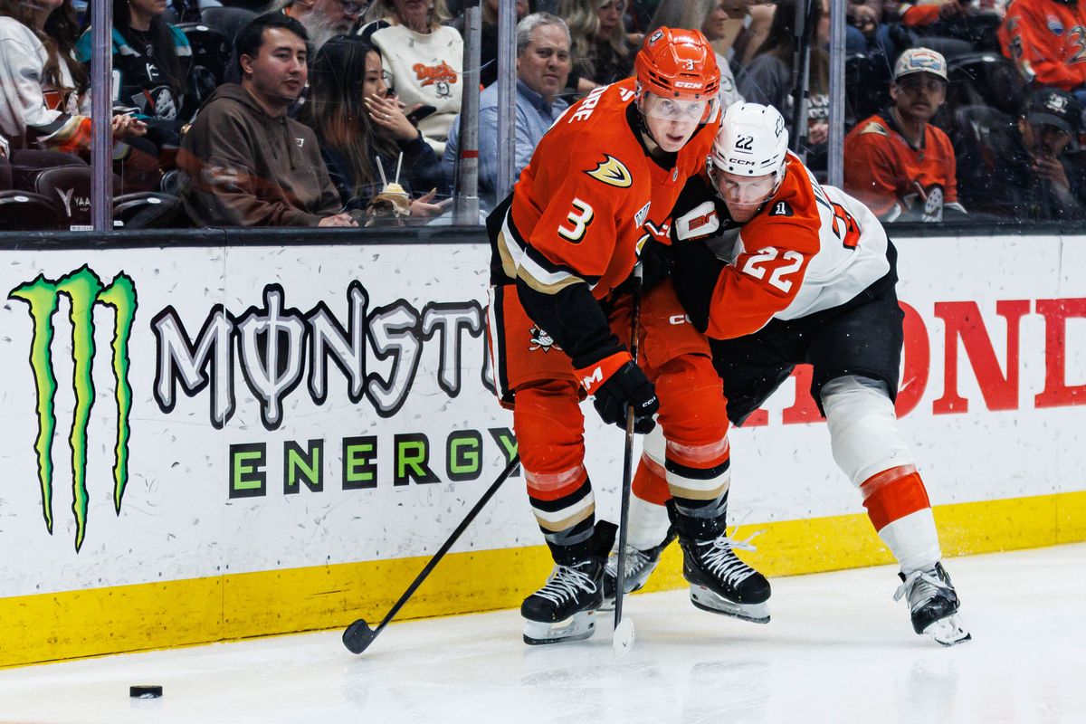 Anaheim Ducks defenseman Ian Moore (#3) battles for possession of the puck during an NHL match against the Philadelphia Flyers on March 18, 2026 in Anaheim, California.