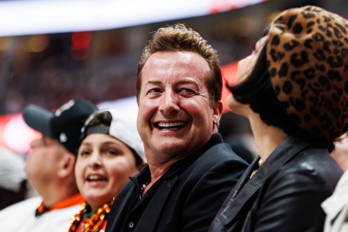 Rock band 'Green Day' drummer Tré Cool reacts after a goal was scored during an NHL match between the Anaheim Ducks and the Philadelphia Flyers on March 18, 2026 in Anaheim, California.