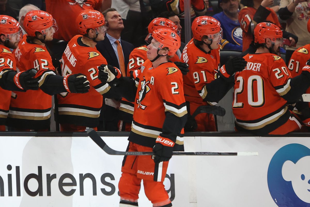 Anaheim Ducks defenseman Jackson LaCombe (2) celebrates scoring a goal with teammates during an NHL game against the Buffalo Sabres on March 22, 2026 in Anaheim, CA. Anaheim Ducks defenseman Jackson LaCombe (2) celebrates scoring a goal with teammates during an NHL game against the Buffalo Sabres on March 22, 2026 in Anaheim, CA.
