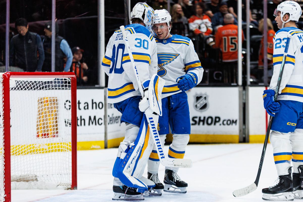 St. Louis Blues goaltender Joel Hofer (#30) celebrates with teammates after a win during an NHL match against the Anaheim Ducks on April 3, 2026 in Anaheim, California. St. Louis Blues goaltender Joel Hofer (#30) celebrates with teammates after a win during an NHL match against the Anaheim Ducks on April 3, 2026 in Anaheim, California.