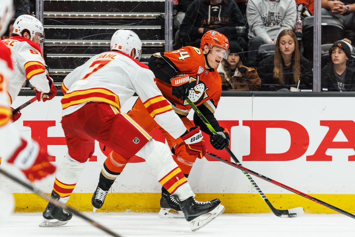 Anaheim Ducks center Mikael Granlund (64) fights for control over the puck during an NHL hockey game against the Calgary Flames, Saturday April 4, 2026 in Anaheim, Calif.